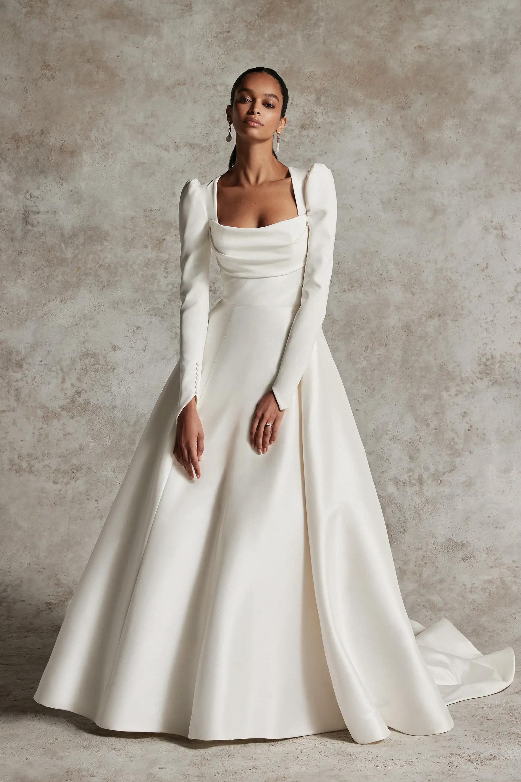 Sleeves of Elegance: Embracing Long Sleeves in December Bridal Fashion Image