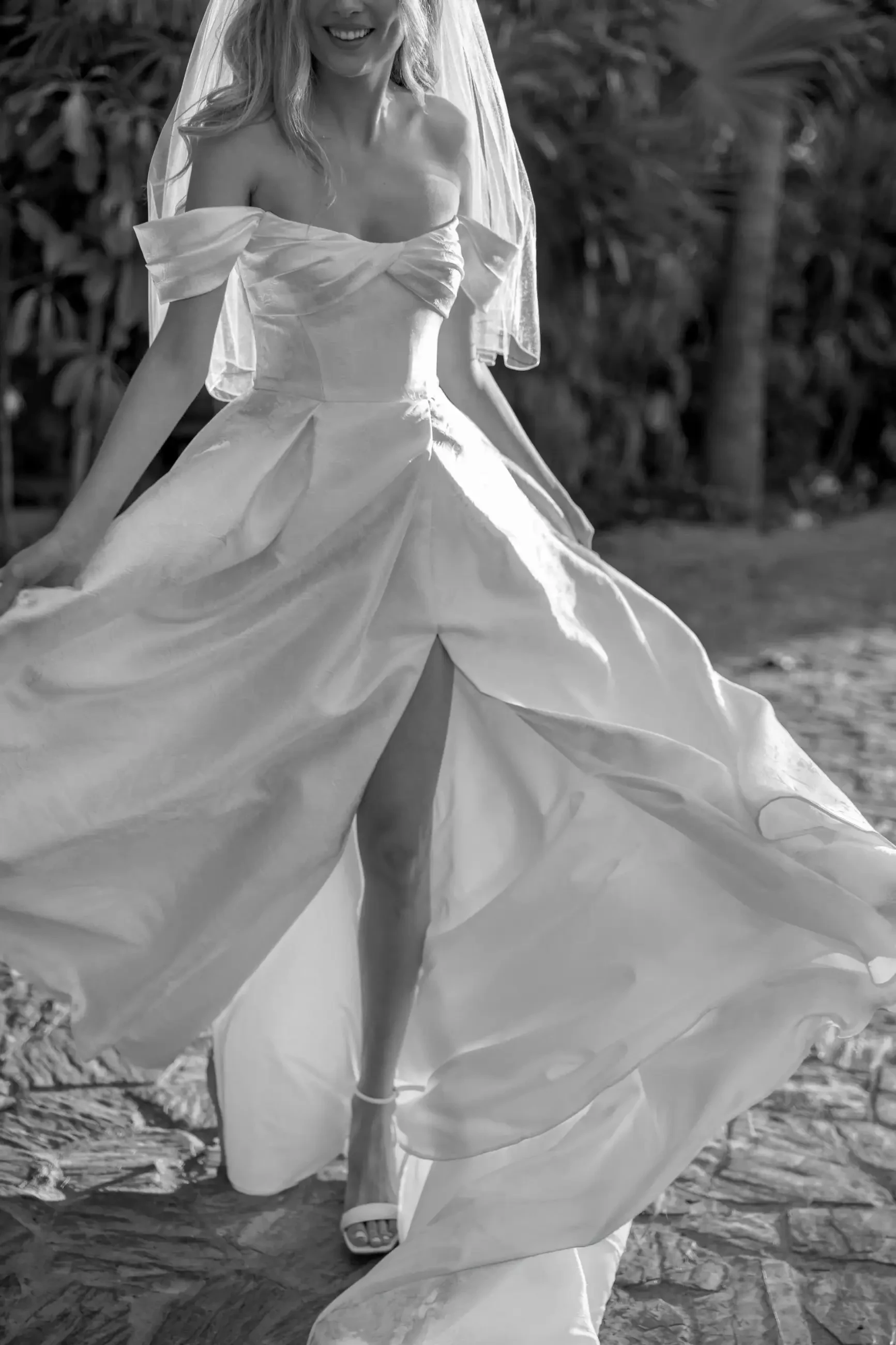 model is wearing an off the shoulder a-line wedding dress